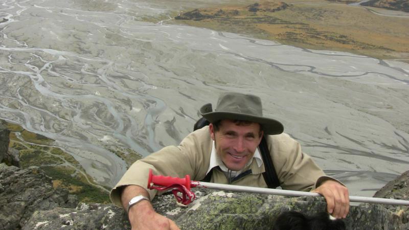 Adam climbing over a difficult spot